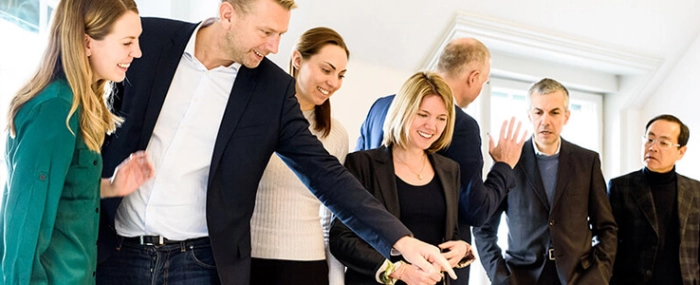 team-pointing-at-map