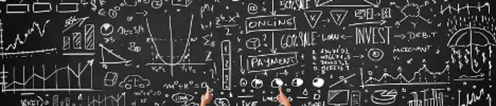 businessman-sitting-in-front-of-blackboard